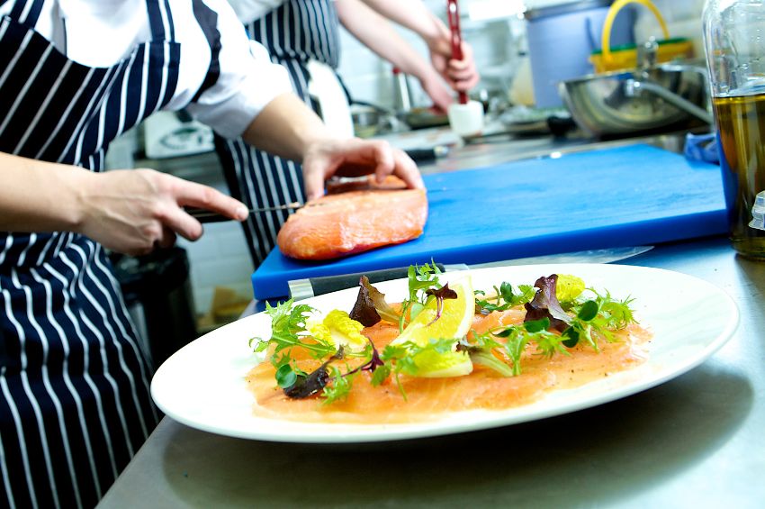 Food being prepared in a restaurant on the look out for cross contamination and cross contact